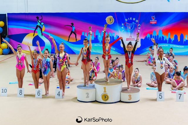 The full field lined up on the podium at the end of a meet